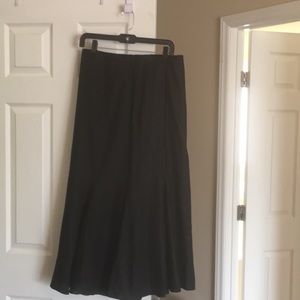 Long black pleated skirt. 100%linen satin lining.